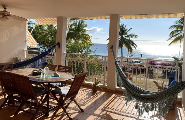 Carbet Apartment on the beach side of standing with your feet in the water
