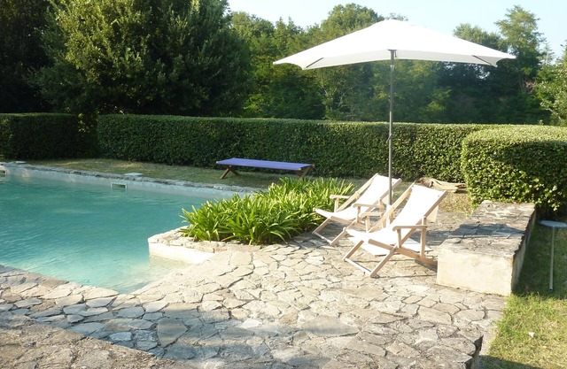 Casale Oliva in a landscape of oaks, olives and cherry trees.