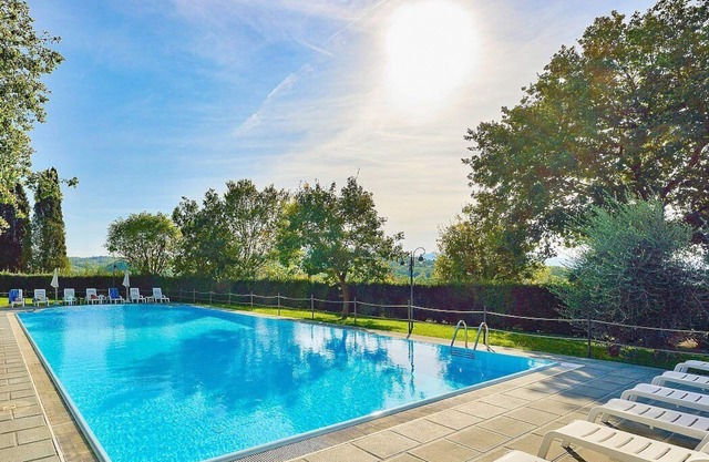 Casa Caprifoglio G: A characteristic and welcoming two-story apartment that is part of a villa surrounded by the greenery, with Free WI-FI.