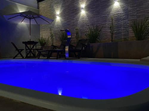 Casa com piscina e um quarto com ar split pé na areia a 50 metros da praia