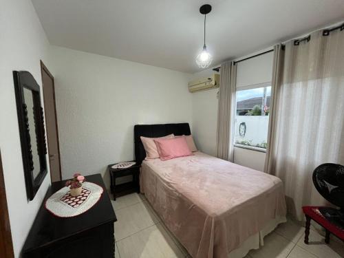 Casa compartilhada com suíte privativa