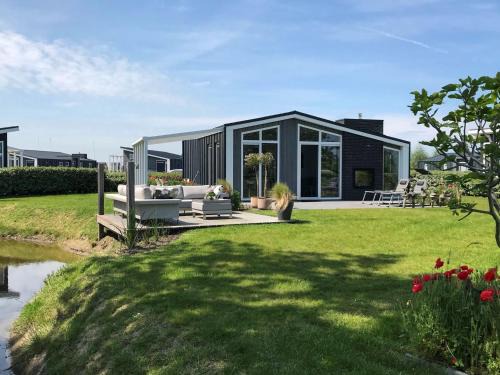 Chalet in Zeeland with Garden and Fireplace