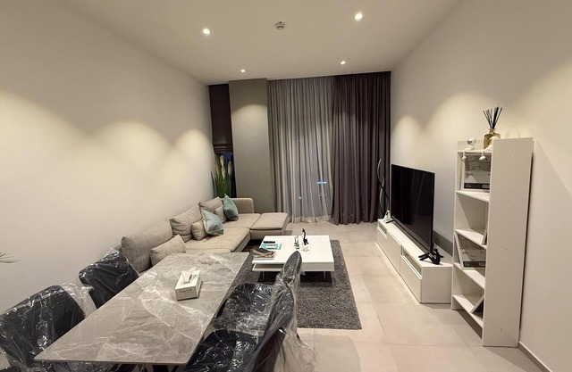 Charming 1BR on high floor in Seef with gym & pool.