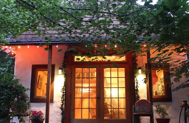 Charming cozy cottage secluded in private woods in great close in location.