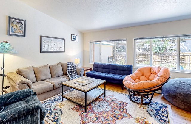 Charming dog-friendly home with hot tub, deck, firepit, central AC, & W/D