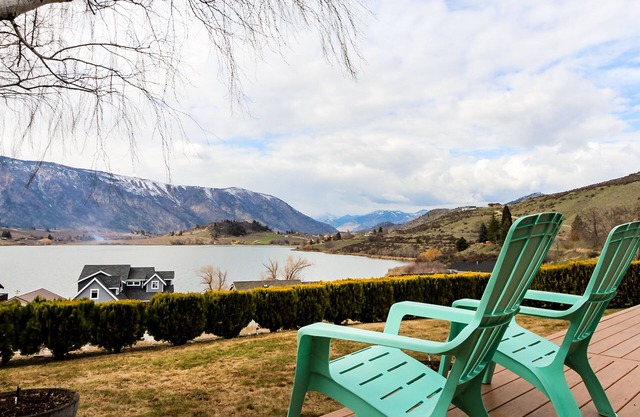 Charming home w/great deck, patio & views overlooking Roses Lake