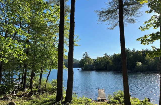 Charming lakefront 2-bedroom cottage with private beach & dock.