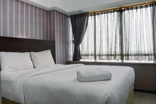 Chic and Cozy 1BR Apartment at H Residence near MT Haryono By Travelio