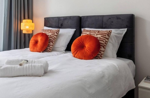 Chic stay with parking, WiFi, and modern amenities near shops and scenic trails. Sleeps four guests.