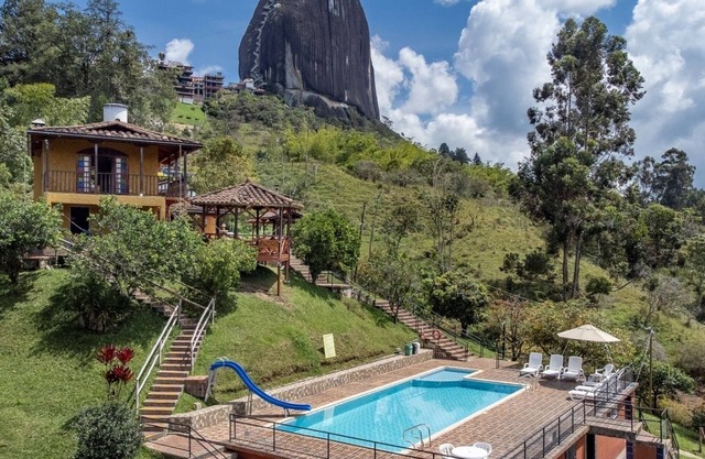Chiriqui farm in Guatape in front of the Peñol stone