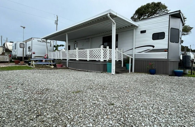Clean and Modern Beachside home with Partial AC and cozy patio