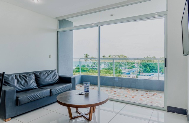 Coastal condo with stunning sea views, rain shower & private balcony escape