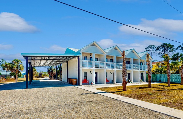 Coastal getaway steps from the bay with patio, open layout, smart TVs, & W/D