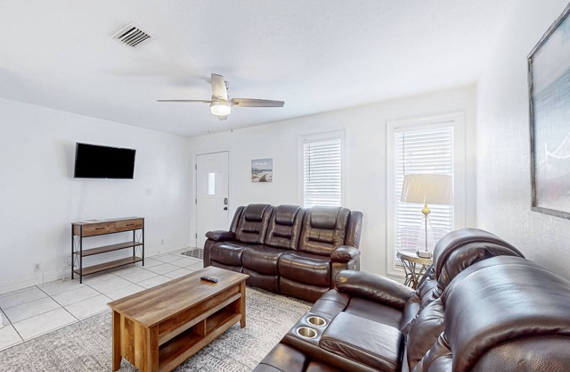 Coastal hideaway steps from the bay with balcony, W/D, open layout, & AC