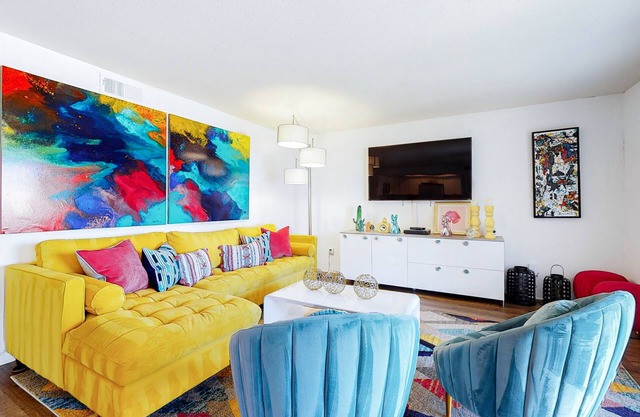 Colorful condo w/a private balcony, gated entrance, shared pools