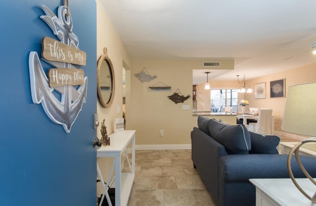 Come to your HAPPY PLACE! 2/2 ground floor waterfront community Condo!