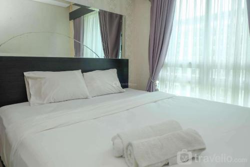 Comfort and Elegant 2BR at Woodland Park Residence Apartment By Travelio