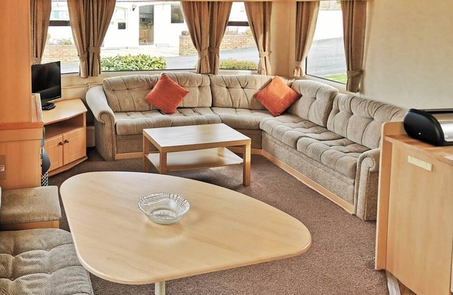 Comfortable and spacious 12ft-wide caravan with one double and two twin.