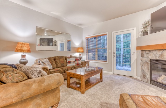 Comfortable condo with fireplace, heated pool, hot tub, balcony & full kitchen