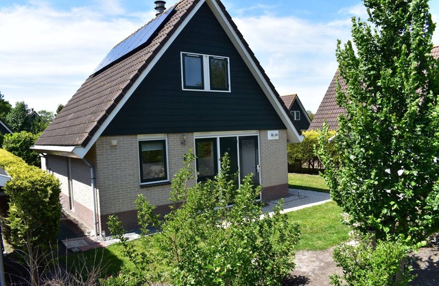 Comfortable holiday home near the beach with garden, with playground and pool