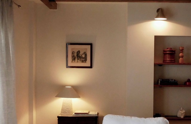 Comfortable living on a farm surrounded by greenery and art