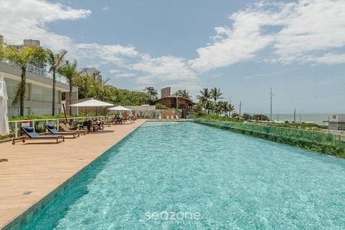 Condomínio a beira-mar c/piscina - SHC