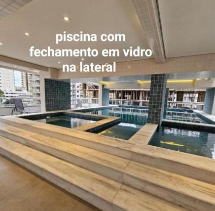 condominio clube com piscina climatizada com fechamento em vidro - Vila Caiçara - Praia Grande 4 adultos e 1 criança até 12 anos