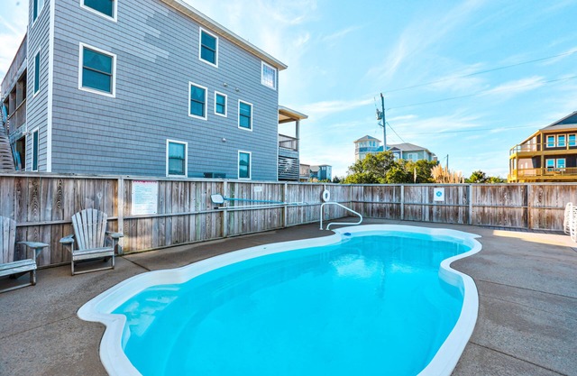 Contemporary house with pool, hot tub, central AC, washer/dryer, deck, & balcony
