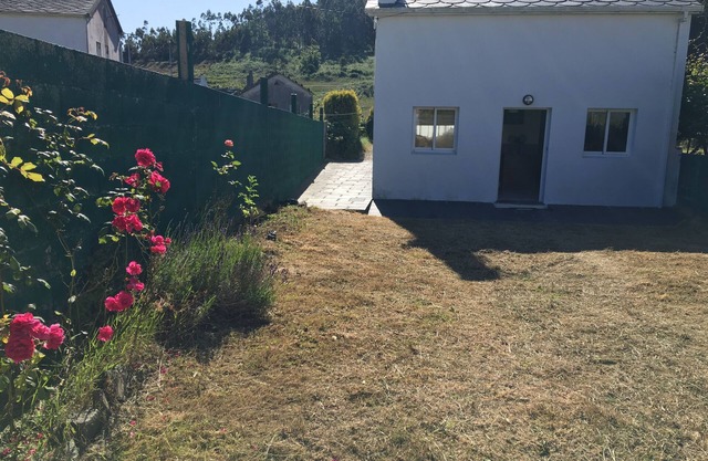 Country house with gate next to the sea