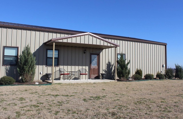 Country hilltop retreat on 10 acres with a pool and hot tub