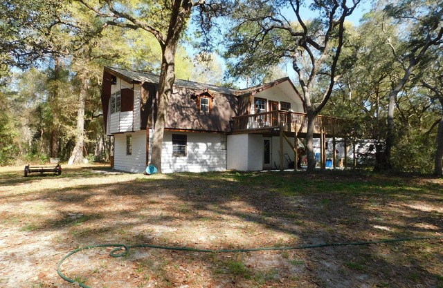 Country living at it's best! Rustic 1908 Barn nestled on 2.5 acres of old oaks