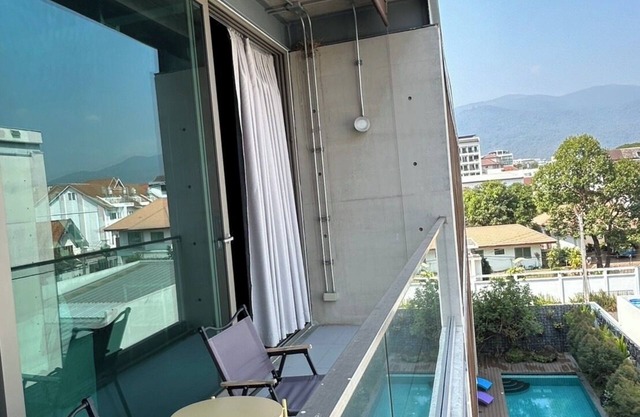Cozy loft-style rooms, private baths, free Wi-Fi, A/C, and shared spaces.