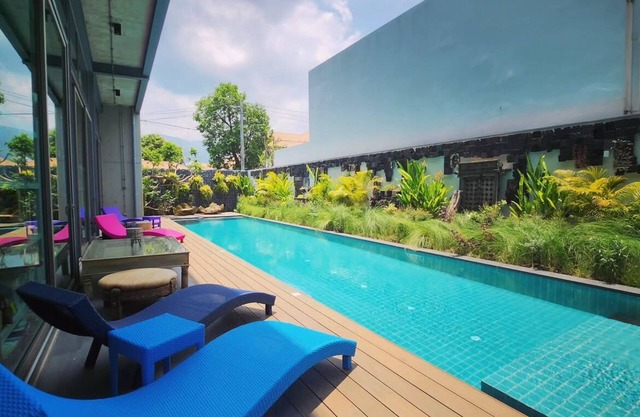 Cozy loft-style rooms, private baths, free Wi-Fi, A/C, and shared spaces.