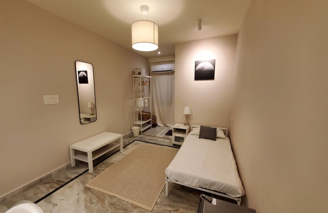 Cozy 1-bedroom apartment in charming Manikonda with AC, WiFi, water heater.