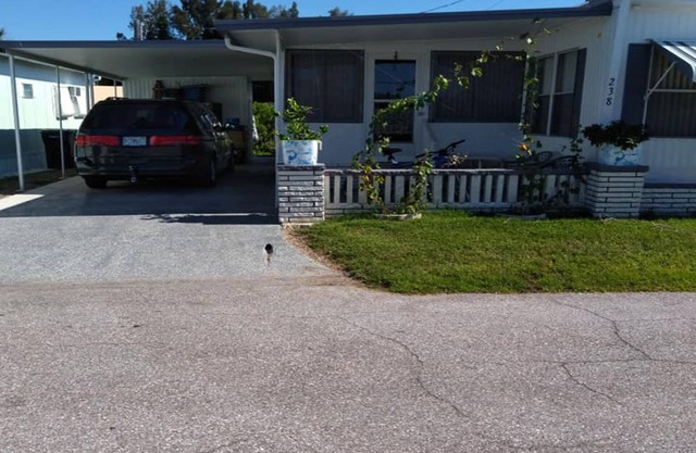 Cozy 1-bedroom mobile home on rim canal with dock, Palmetto Fla.