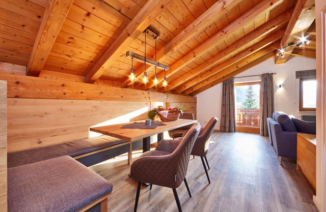 Cozy 65 sqm attic apartment with open roof truss and two balconies