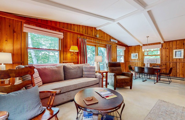 Cozy abode with a deck, grill, wood stove, full kitchen, W/D, and partial AC