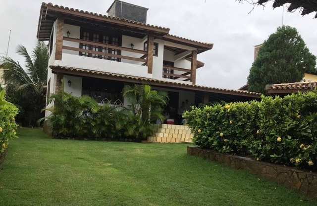 Cozy and charming house with pool and gardens in sea front condominium!