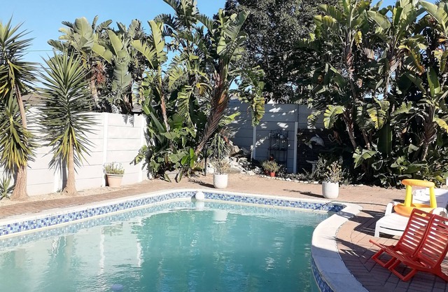 Cozy cottage for family getaway with private patio and pool in safe suburb.