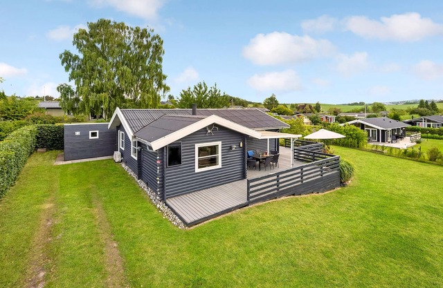 Cozy, family-friendly cottage with wood stove, located in the popular and quiet area Følle Strand cl