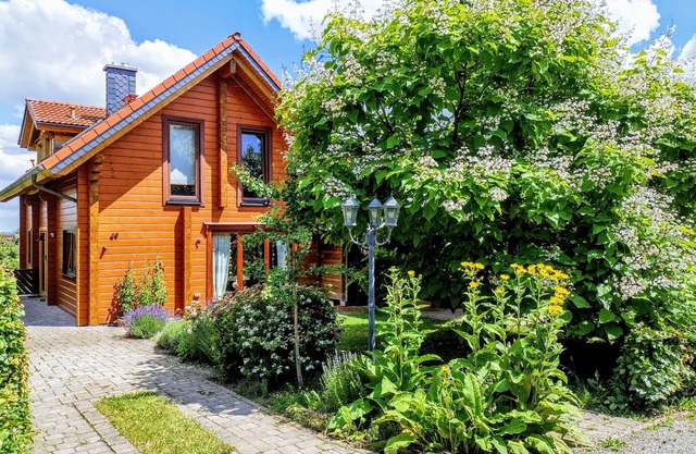 Cozy log cabin by the forest with large garden