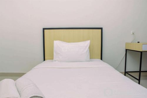 Cozy Studio with Single Bed at Evenciio Margonda Apartment By Travelio