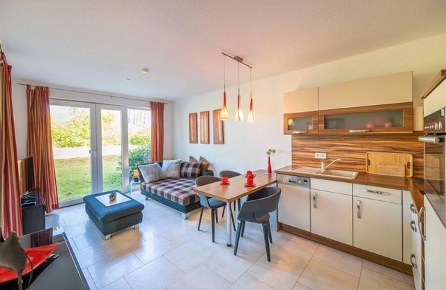 Cozy vacation apartment with covered terrace, right on the beach