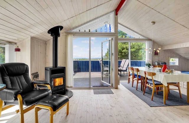 Cozy wooden house located directly on the Limfjord.