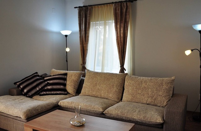 Deluxe apartment with fully equipped kitchen, located in a house.