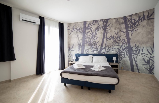 Deluxe Suite 1 with Shared Pool and Private Balcony
