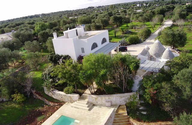 Dionisia trulli with swimming pool, private trullo and sea view among olive tree