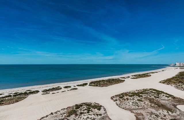 Direct Gulf Front Southern Exposure corner unit with TWO BALCONIES!.