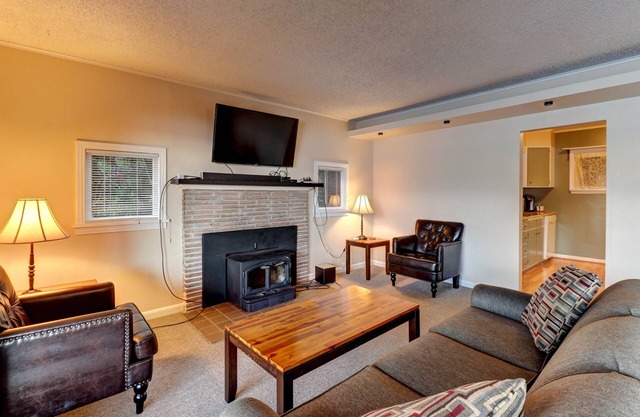 Direct waterfront - welcoming home with fireplace, full kitchen & furnished deck