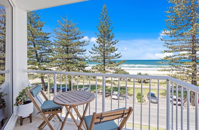 Discover coastal relaxation with this beachfront apartment.